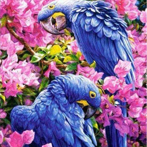 Blaue Papageien in rosa Blüten Diamond Painting